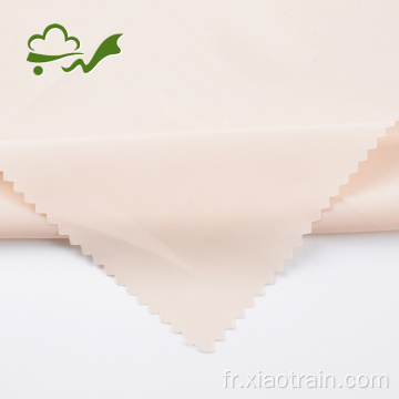 Tissu en mousseline de soie pêche drapé pour robe de femme